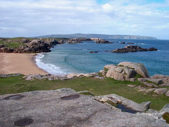 A rocky bay with a sandy beach on Cruit Island, Donegal.